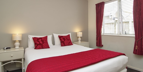comfortable queen size bed and single beds in the unit